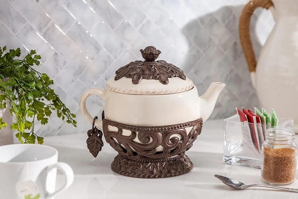 Cream Stoneware Teapot with Metal Acanthus Leaf Holder. -- Size: 9.5