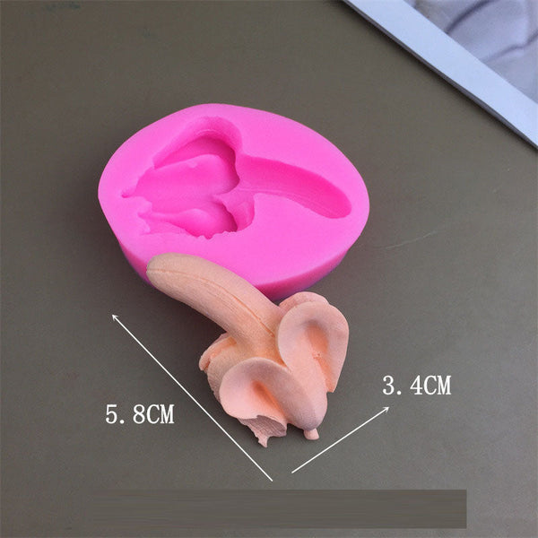 A 3D banana mousse cake with jelly pudding baked and decorated using silicone molds