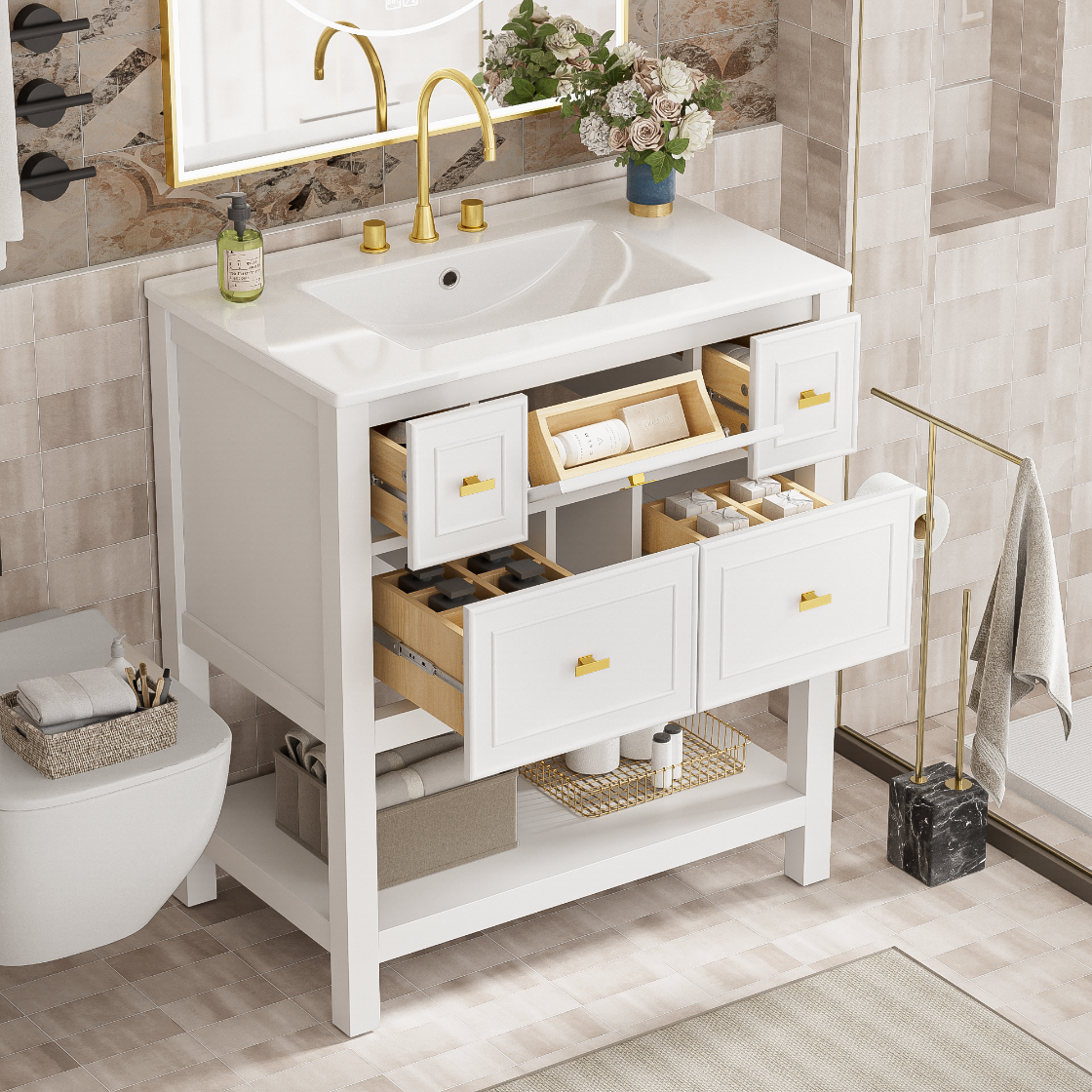 Bathroom vanity with open drawers and a mirror above in a tiled bathroom.