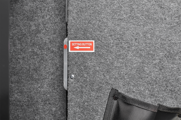 Gray textured surface with a red and white label labeled 'Setting Button' on a black background