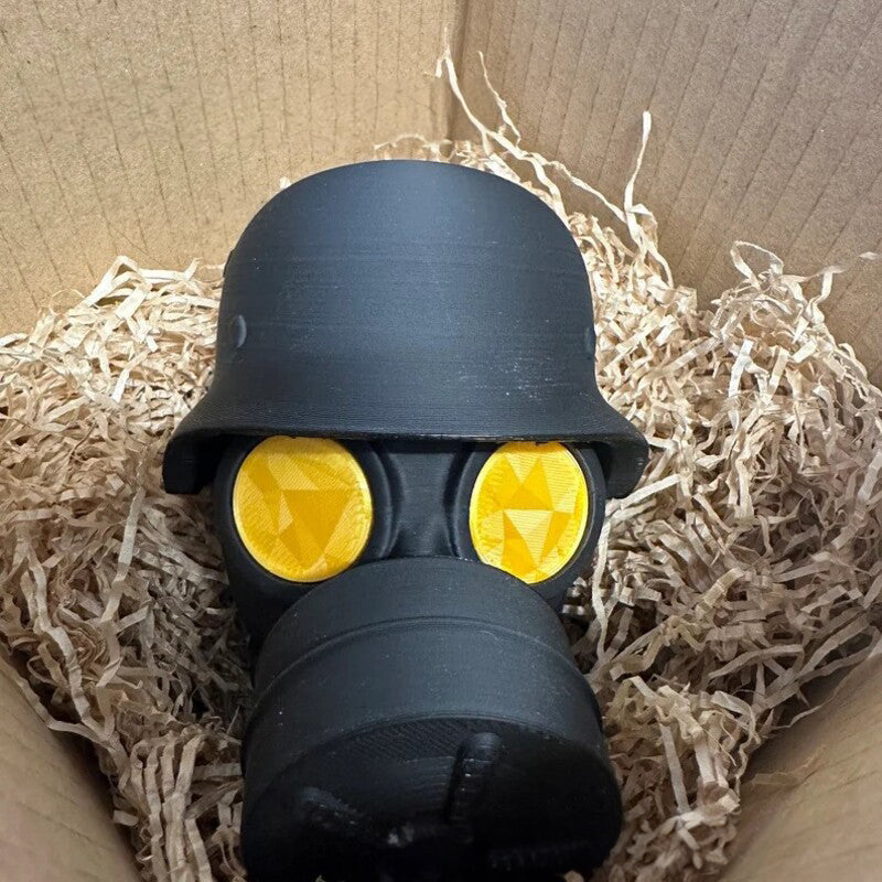 3D - printed trailer hitch cover with steel helmet and gas mask design. Protects the receiver tube from rusting.