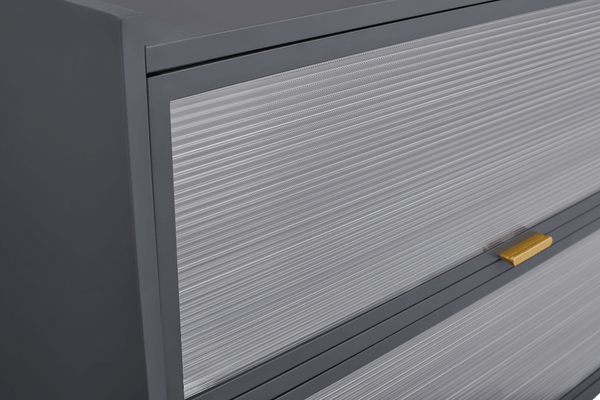 Close-up of a gray cabinet with a gold handle