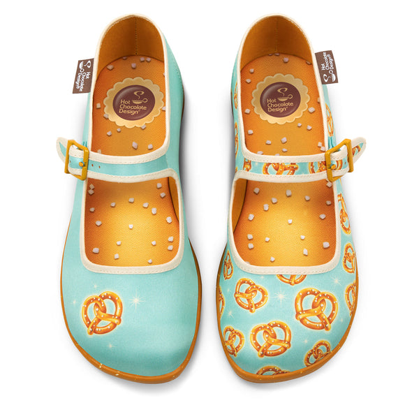 Pair of colorful shoes with pretzel pattern on a white background