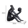Abstract Seated Figure Sculpture Holding a Head - black