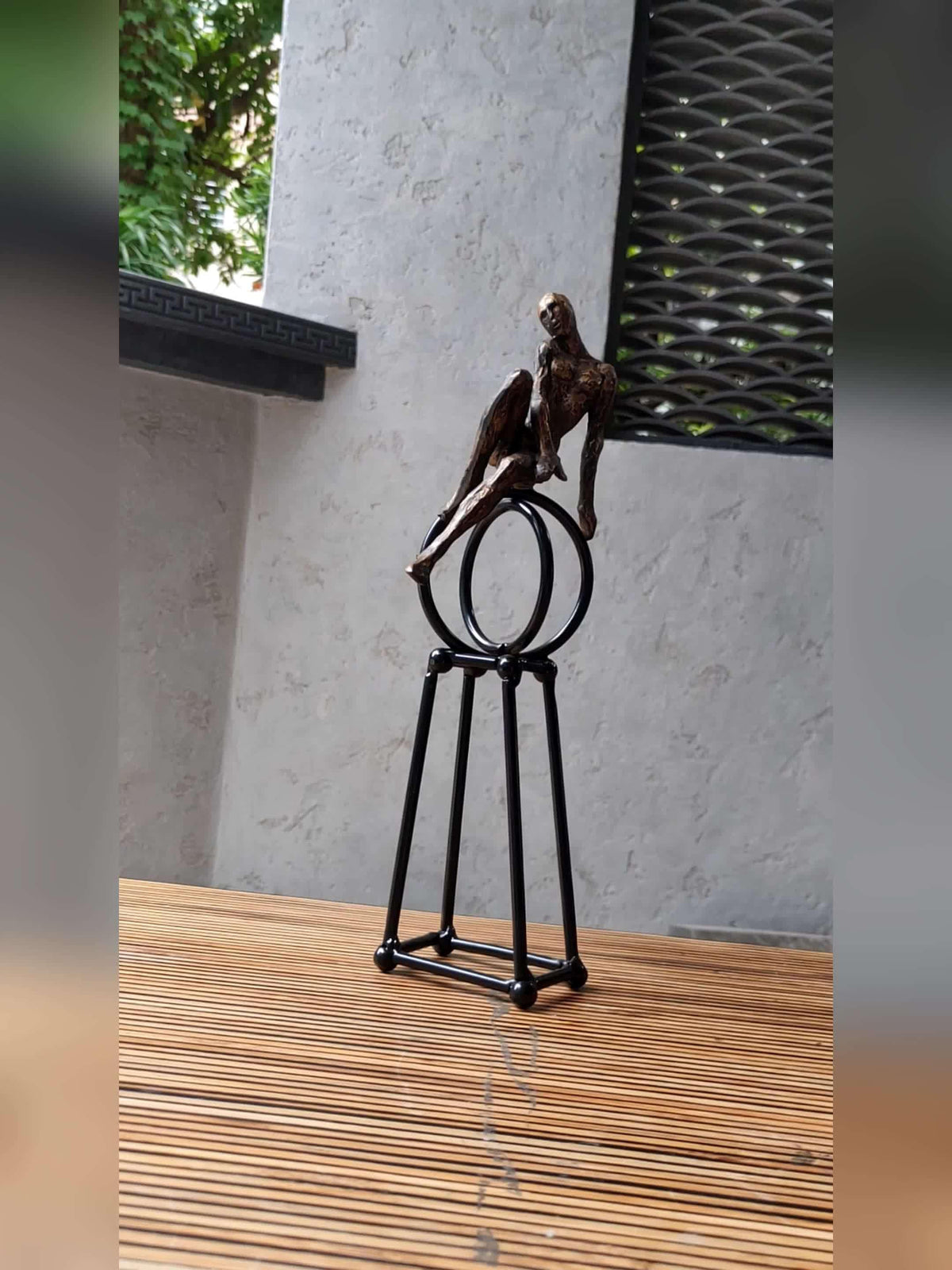 Abstract Seated Figure Sculpture on Geometric Stand – Modern Iron Table Decor