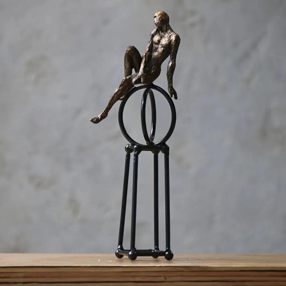 Abstract Seated Figure Sculpture on Geometric Stand – Modern Iron Table Decor