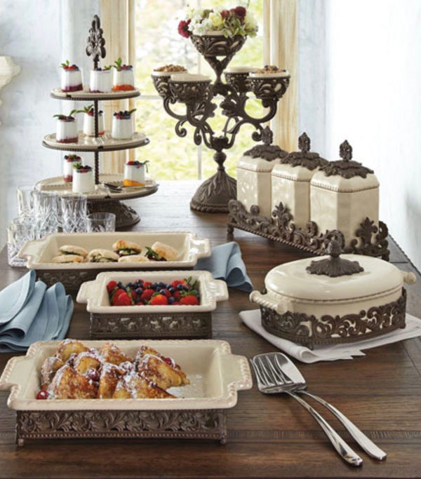 Decorative servingware set on a wooden table with a blurred background