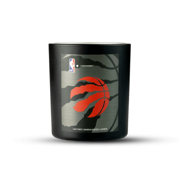 Black candle with Toronto Raptors logo on a white background