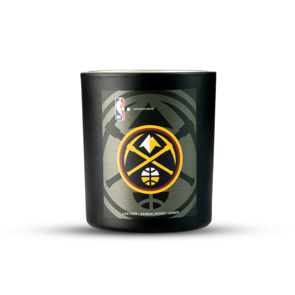 Black candle with a basketball team logo on a white background