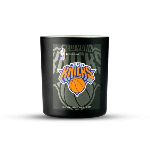 Black candle with New York Knicks logo on a white background