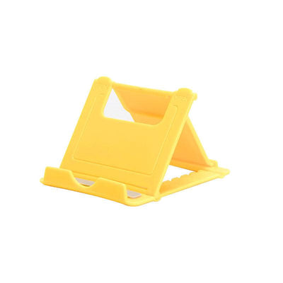 A plastic, foldable cradle for mobile phones