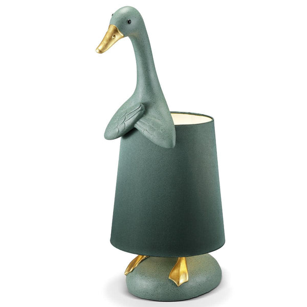 Bashful Duck Lamp – Whimsical Green & Gold
Green goose-shaped lamp with gold accents on a white background