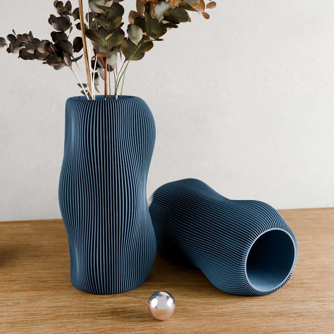 Two blue textured vases on a wooden surface with a neutral background