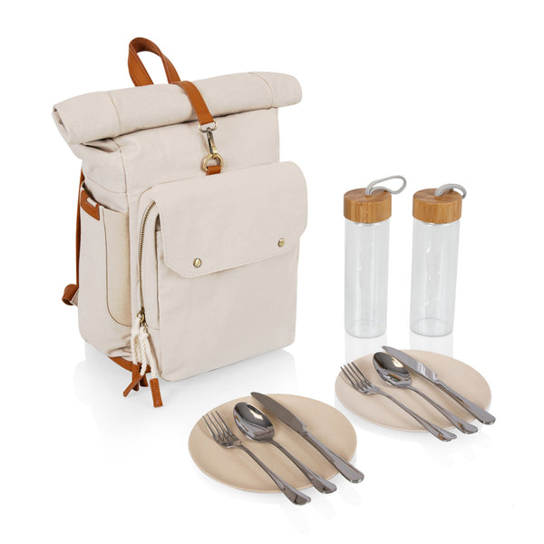 Beige backpack with picnic accessories including cutlery, plates, and water bottles on a white background
