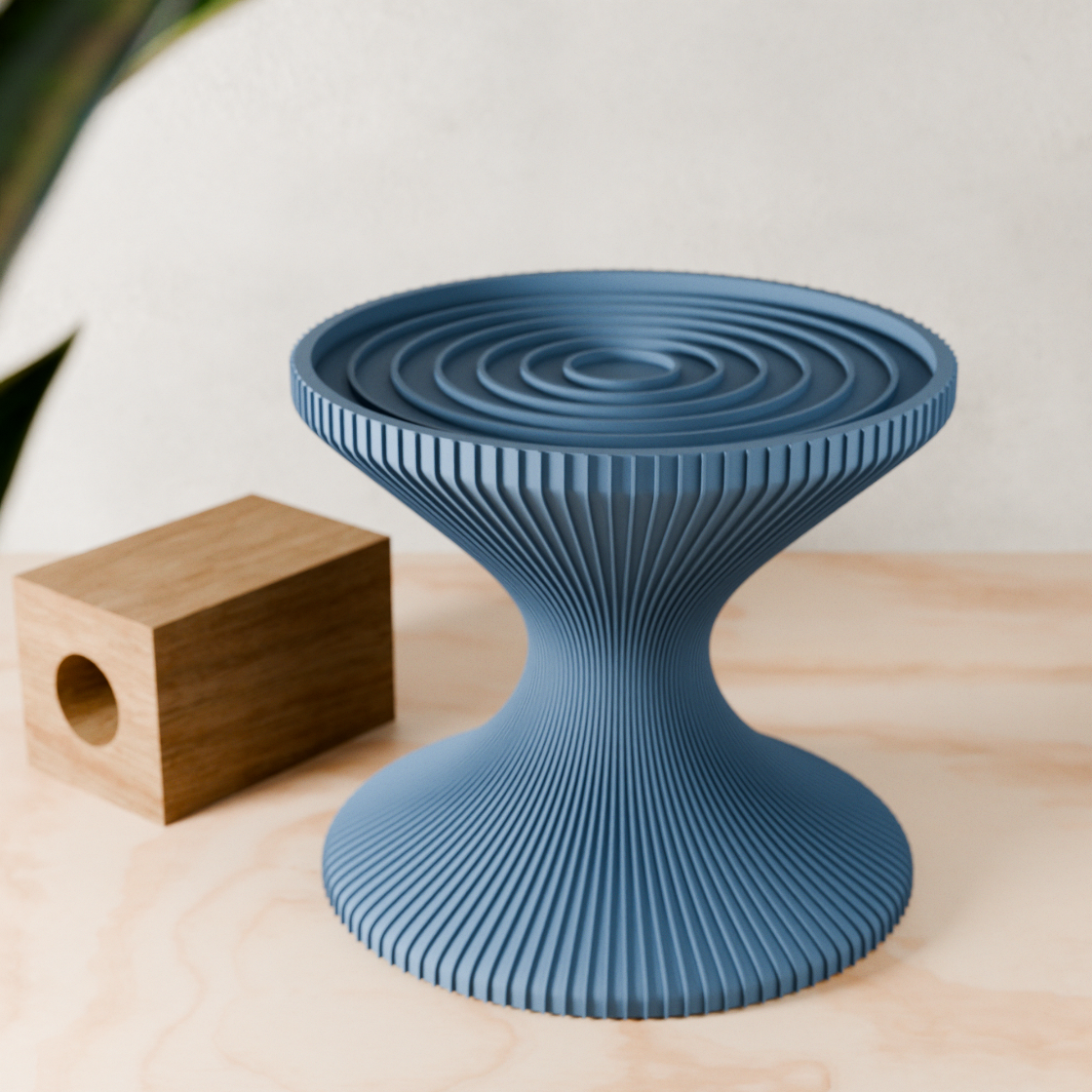 Blue textured stool on a wooden surface with a blurred background