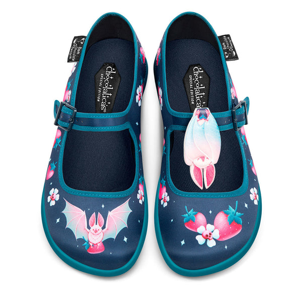 Chocolaticas® Albine Bat Women's Mary Jane Flat - Pair of children's shoes with cartoon character design on a white background