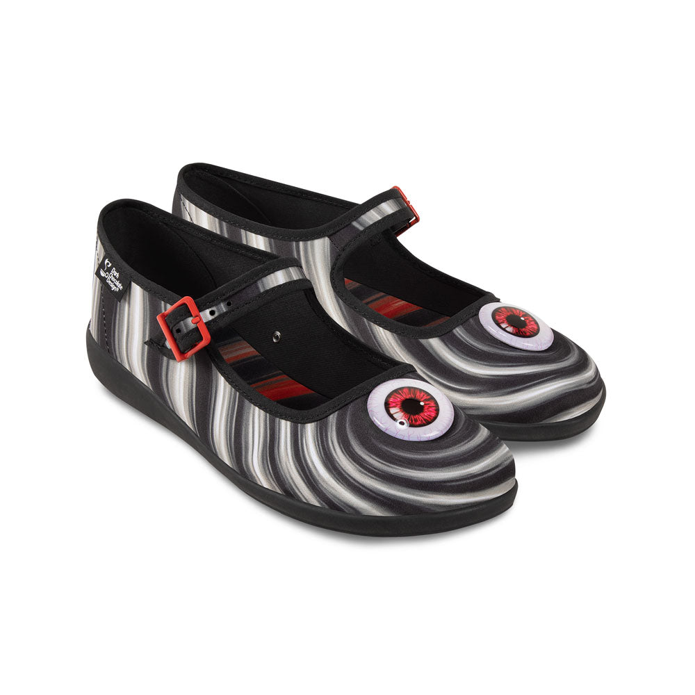Chocolaticas® Abbys Women's Mary Jane Flat - Black and white striped shoes with red buckle and eye-like design on a white background