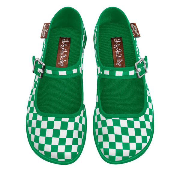 A pair of green checkered women's flats with buckles and the Hot Chocolate Design logo on the strap.