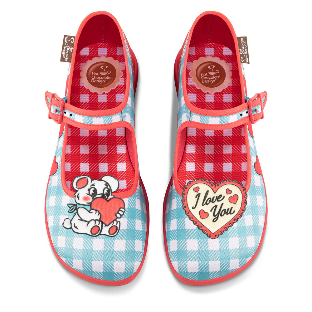 Chocolaticas® I Love You Women's Mary Jane Flat - Pair of children's shoes with cartoon character and 'I Love You' heart design on a white background