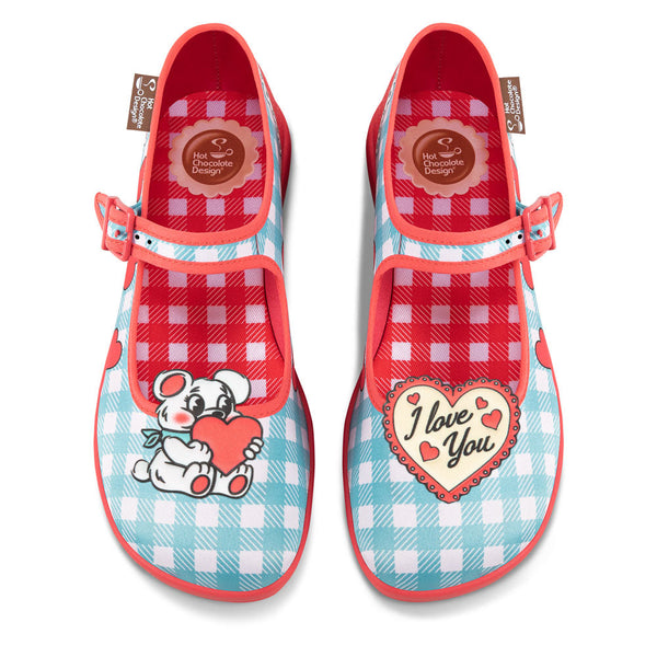 Chocolaticas® I Love You Women's Mary Jane Flat - Pair of children's shoes with cartoon character and 'I Love You' heart design on a white background