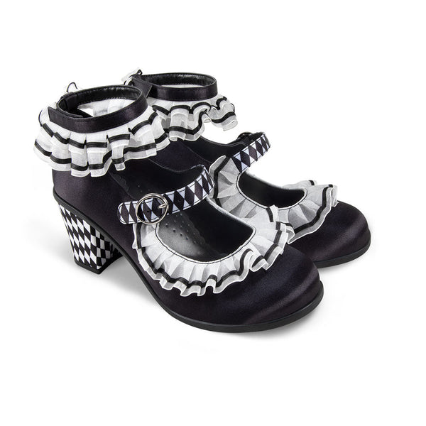 Chocolaticas® Mid Heels Arlequin Women's Mary Jane Pump - Black and white checkered shoes with ruffled details on a white background