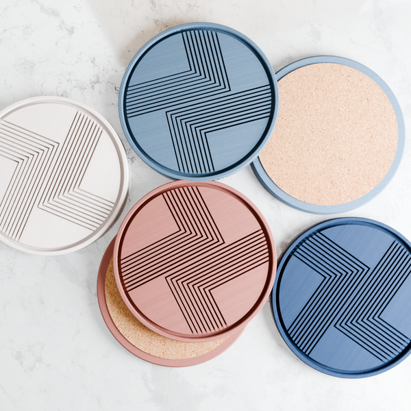 Five round cosmetic products with geometric patterns on a light gray background