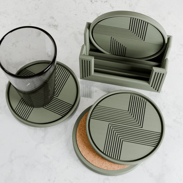 Set of green coasters with geometric patterns on a white surface