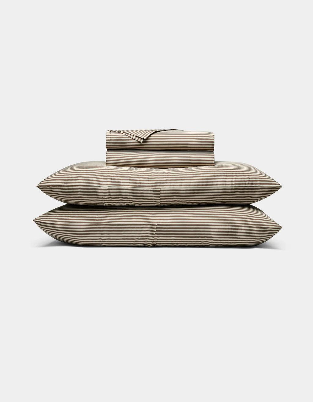 Classic Stripe in Ebony Striped bed sheets and pillowcases on a white background