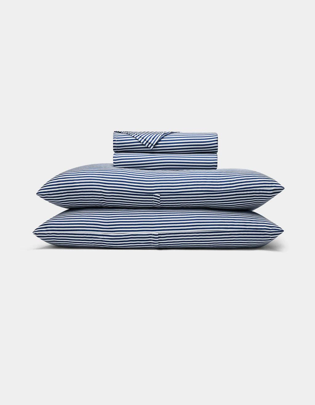 Classic Stripe in Pacific and white bedding set on a light gray background