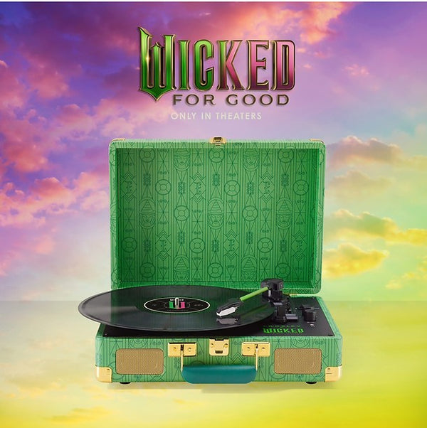 Green record player with 'Wicked' branding against a colorful sky background