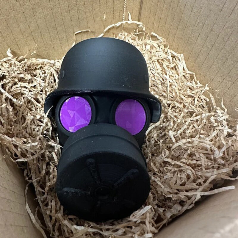 3D - printed trailer hitch cover with steel helmet and gas mask design. Protects the receiver tube from rusting.