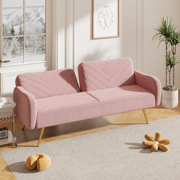 Pink sofa in a room with a window, plant, and decorative items.