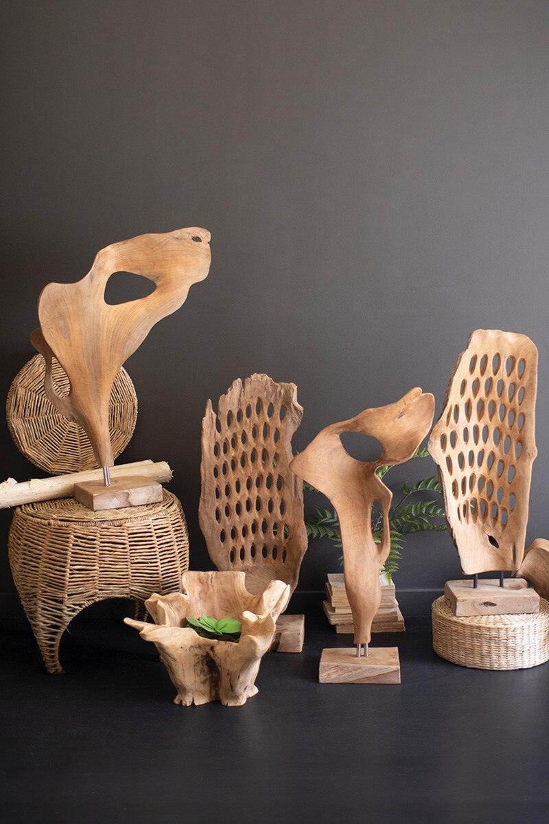 HAND-CARVED TEAK WOOD SCUPLTURE ON A BASE - PERFORATED