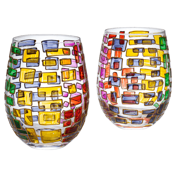 Two colorful stemless wine glasses with geometric pattern on a white background