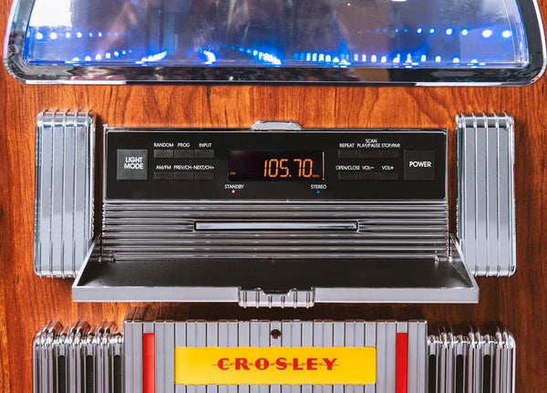 Digital LED Jukebox with Bluetooth - Walnut
CR1215A-WA. Vintage Crosley radio with digital display on a wooden surface
