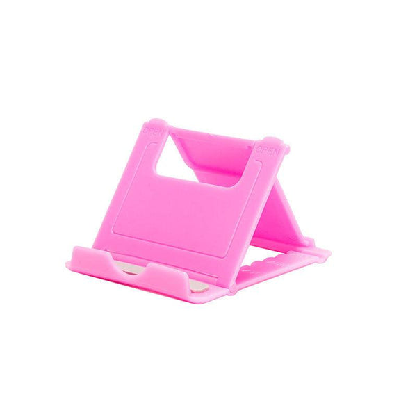 A plastic, foldable cradle for mobile phones