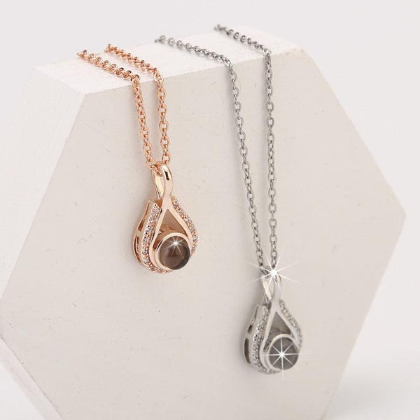 Waterdrop shaped fashion projection necklace with 100 languages. I love you. Color photos, customized lover accessories