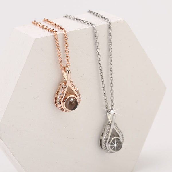 Waterdrop shaped fashion projection necklace with 100 languages. I love you. Color photos, customized lover accessories