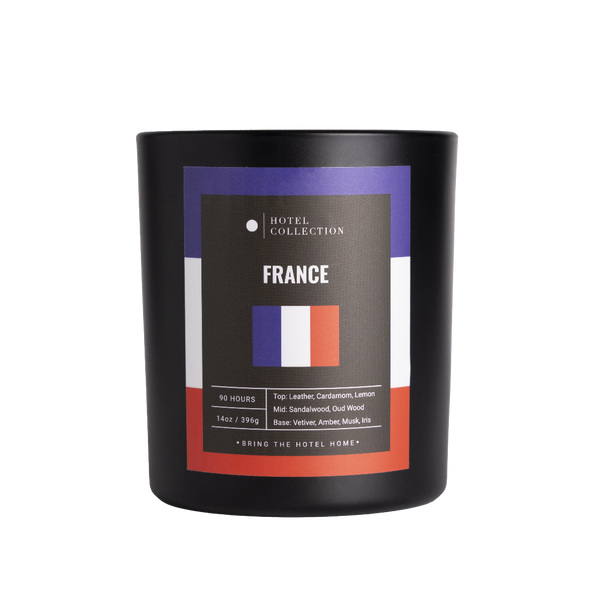 Candle with 'France' label and Hotel Collection branding on a white background