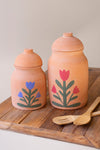 SET OF TWO CLAY CANISTERS WITH PAINTED FLOWER DETAIL