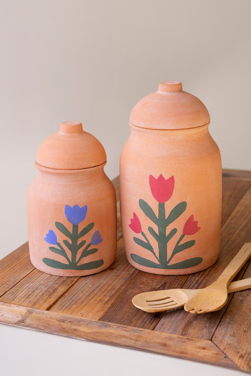 SET OF TWO CLAY CANISTERS WITH PAINTED FLOWER DETAIL