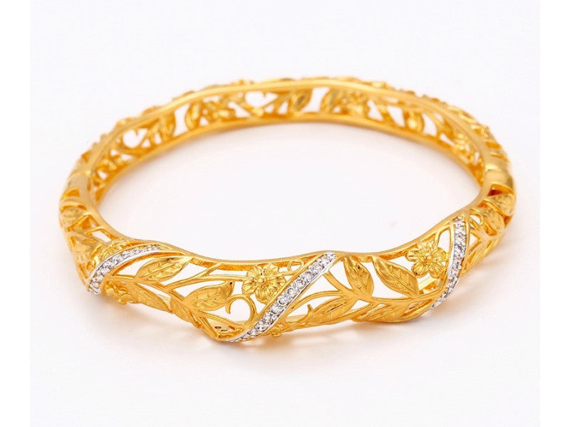 Gold plated bangle adorned with a thin band of white cubic zircons