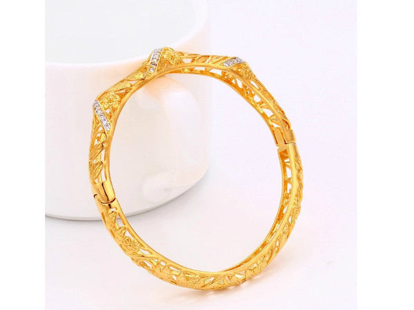 Gold plated bangle adorned with a thin band of white cubic zircons