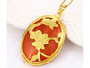 Oval shaped rust-red color noble charms pendant with gold flowers