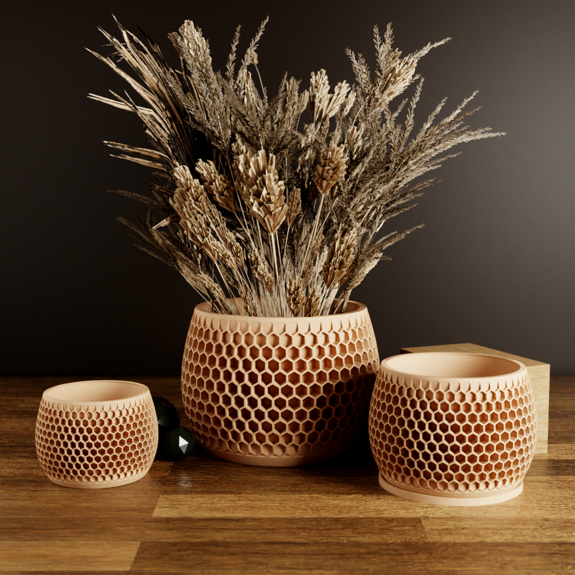 Three wooden pots with honeycomb patterns on a wooden surface