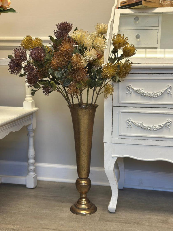 Decorative vase with flowers in a room setting