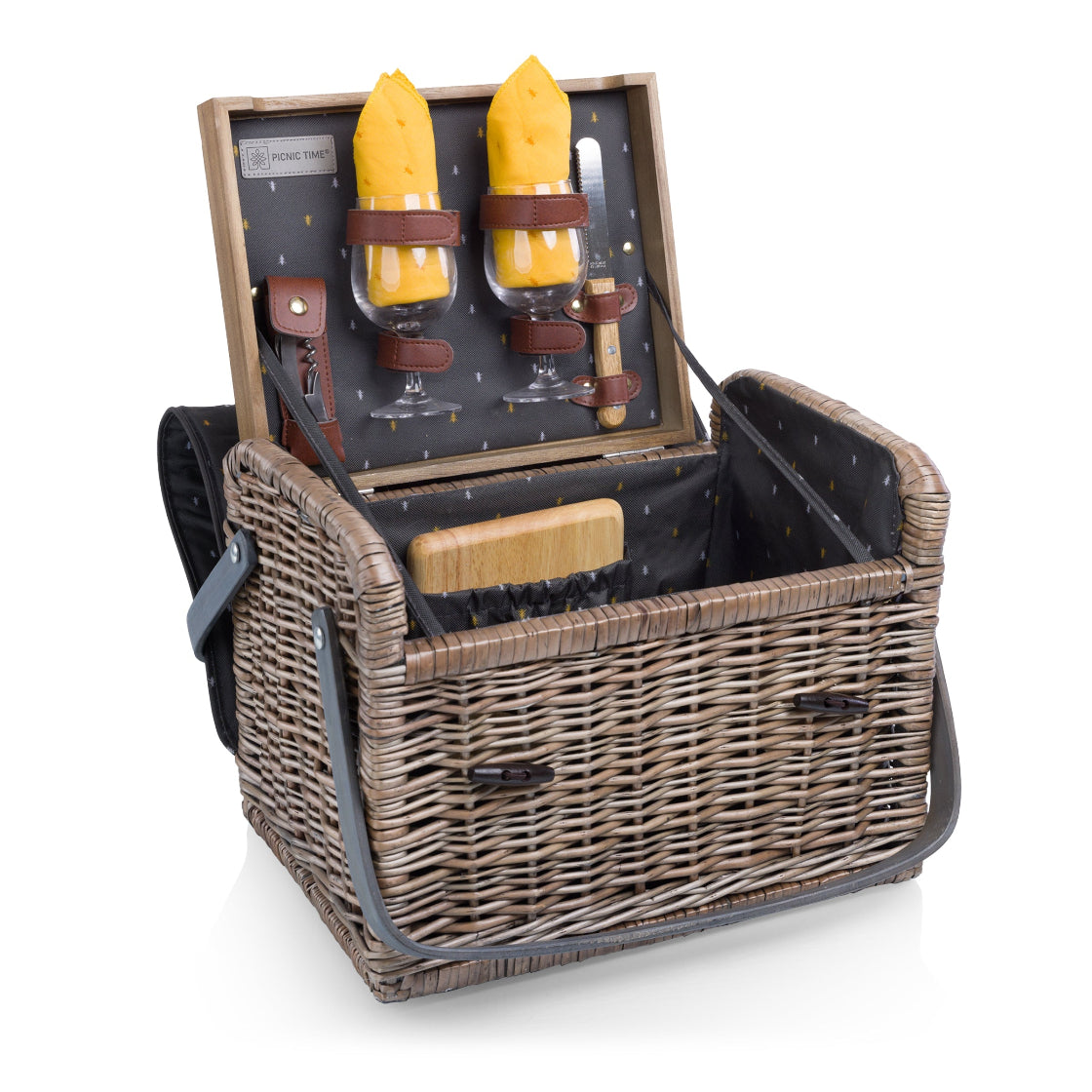 Wicker picnic basket with wine glasses and cheese on a white background