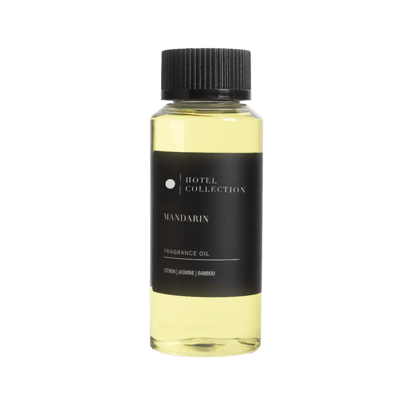 Bottle of Hotel Collection Mandarin fragrance oil on a white background