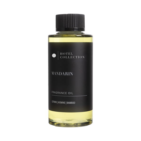Bottle of Hotel Collection Mandarin fragrance oil on a white background