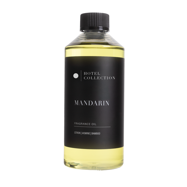 Bottle of Hotel Collection Mandarin fragrance oil on a white background